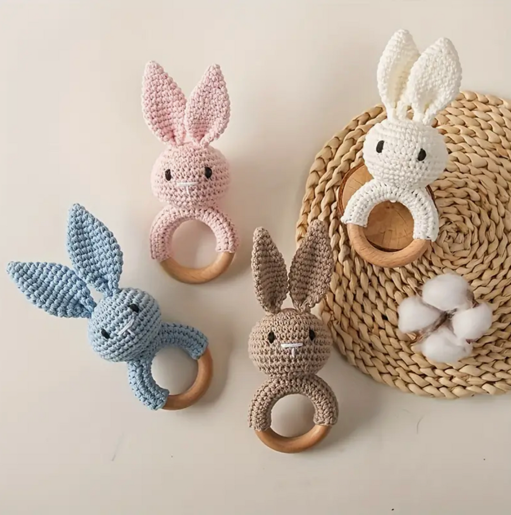 Crochet baby bunny rattle in brown, pink, white and blue