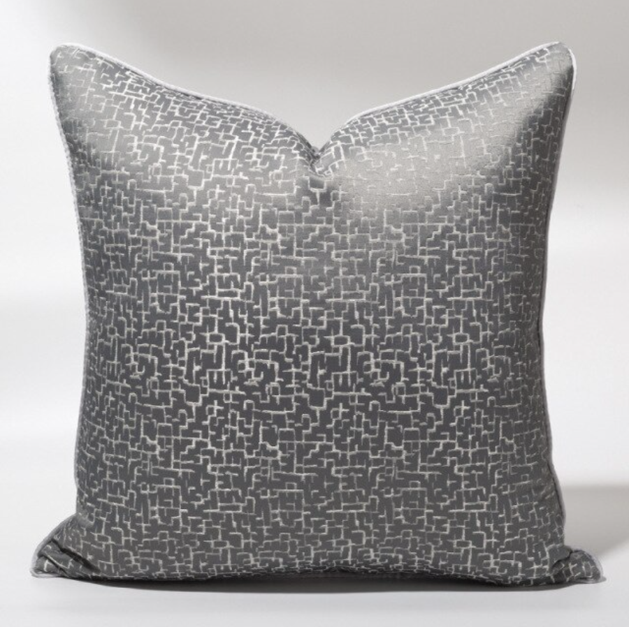 Display of cushion set with grey and silver crackle effect detailing